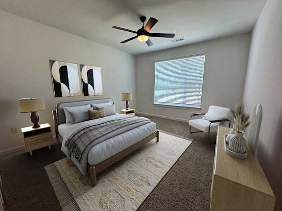A bedroom with a bed, chair, and two lamps.