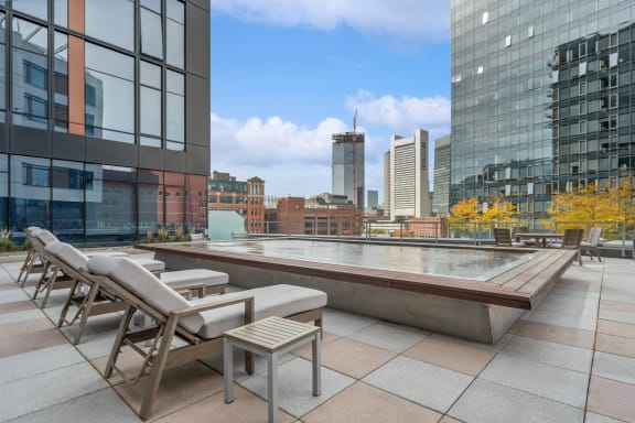 rooftop terrace and sunning deck with lounging areas at Via Seaport apartments