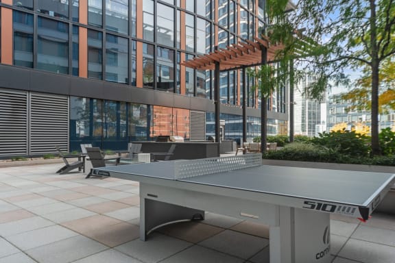 rooftop social area with ping pong at Via Seaport apartments