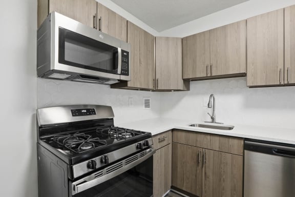 Skyline Towers kitchen with a stove and a microwave