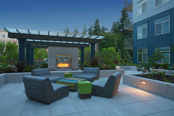 Outdoor Common Area with seating and fireplace