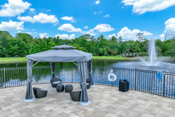lakeside lounging area at The Reserves at Alafaya apartments
