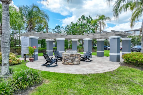 outdoor patio with fireside lounging at The Reserves at Alafaya apartments