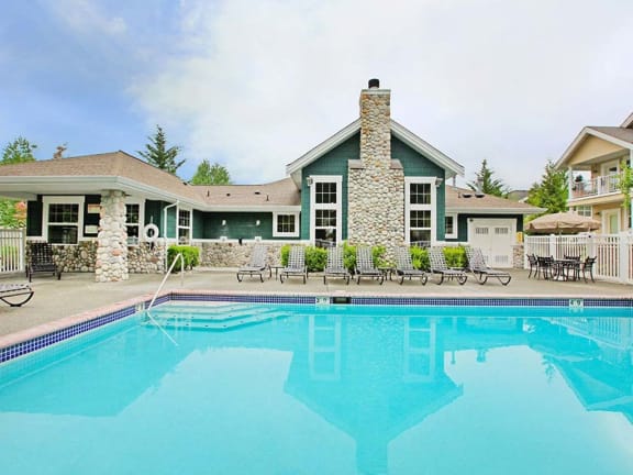 Pool with exterior building view at Echo Ridge Apartments, Snoqualmie, Washington