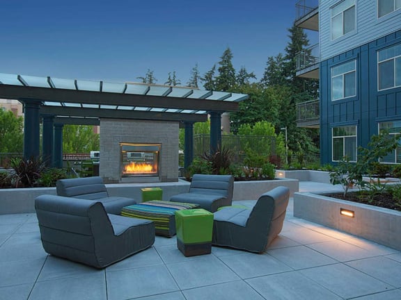 Outdoor Common Area with seating and fireplace at Elan Redmond Apartments, Redmond, WA
