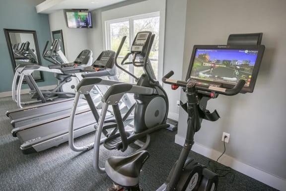 Fitness center cardio machines at Perimeter Lakes apartments