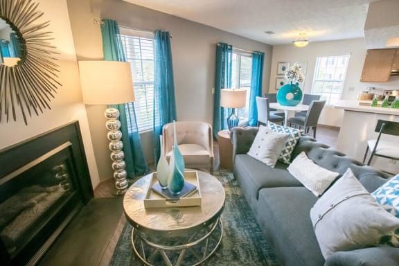 Living room with fireplace at Perimeter Lakes