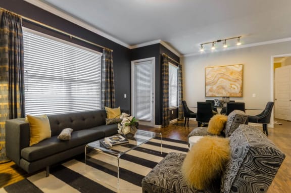 Living room with brown sofas at Park 3Eighty, Aubrey, TX