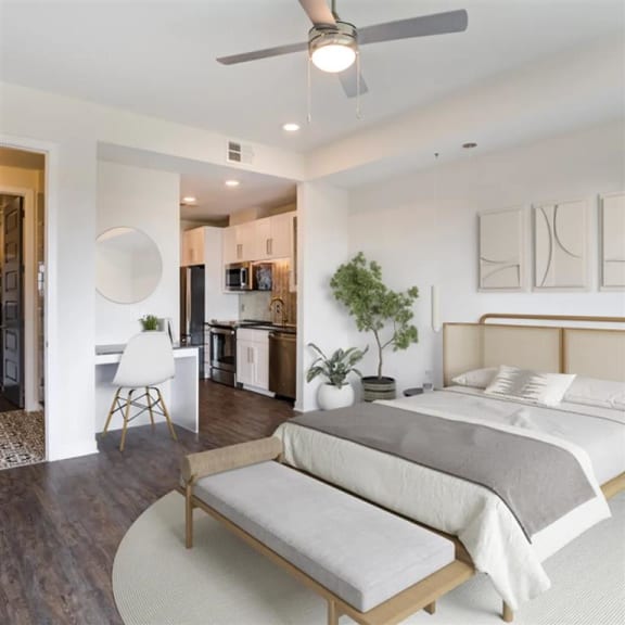 spacious bedroom with a ceiling fan at The Gabriella apartments