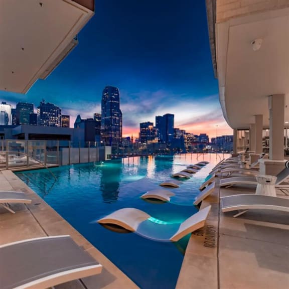 infinity edge pool with Dallas skyline views at The Gabriella apartments