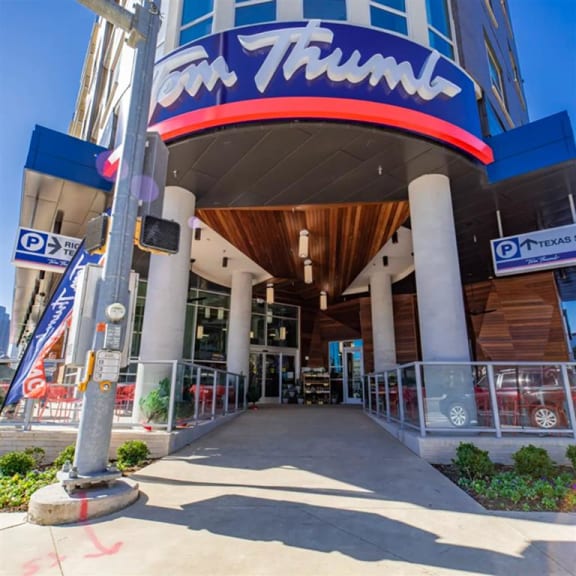 a view of the front the Tom Thumb store at The Gabriella apartments
