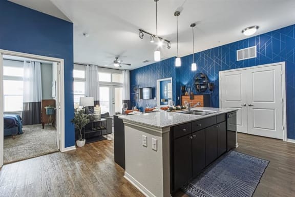 open-concept kitchen and living area at Aspire at 610 apartments