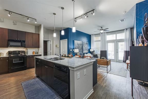 open-concept kitchen and living area at Aspire at 610 apartments