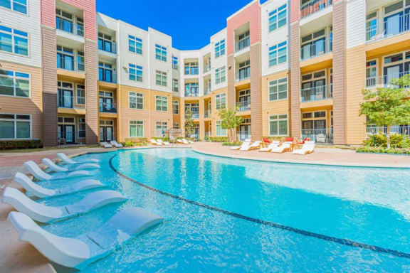 swimming pool with aqua sun shelf at Aspire at 610 apartments