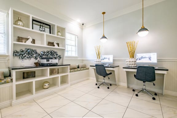 a home office with two desks and two chairs
