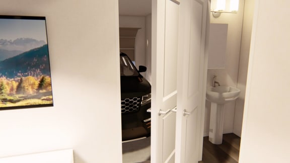 a white door opens to a white bathroom with a sink and a white sink at Brownstones at Palisade Park Townhomes, Colorado