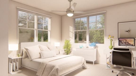 a bedroom with a bed and a desk with a computer at Brownstones at Palisade Park Townhomes, Broomfield, 80023