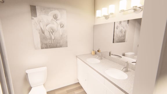 a bathroom with two sinks and a toilet at Brownstones at Palisade Park Townhomes, Broomfield