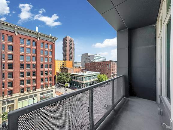 a balcony with a view of the city and a city skyline