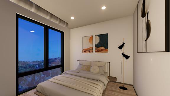 A bedroom with a large bed and a painting on the wall.