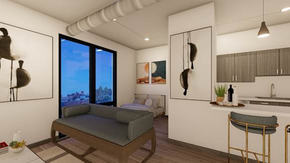 A modern living room with a couch, a bed, and a kitchen area.