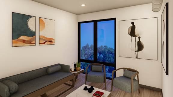 A living room with a grey sofa, two chairs, a coffee table, and three framed pictures on the wall.