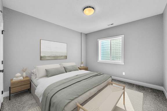 A bedroom with a bed, nightstand, and window.