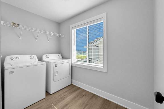 A laundry room with a washer and dryer.