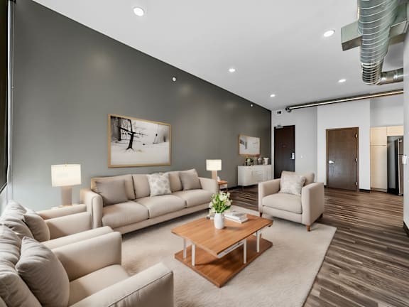 a living room with couches and chairs and a coffee table