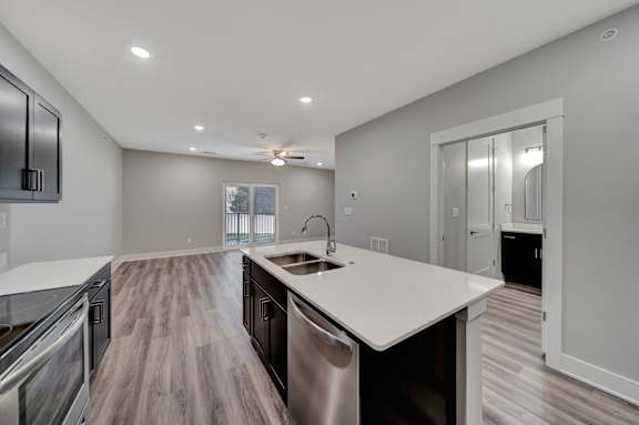 a kitchen with a sink and a mirror