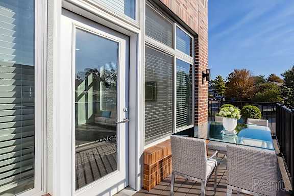 A patio with a table and chairs is shown.