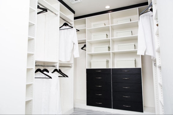 a large closet with black drawers and white closets at Novella Arcadia, Phoenix, AZ 85018