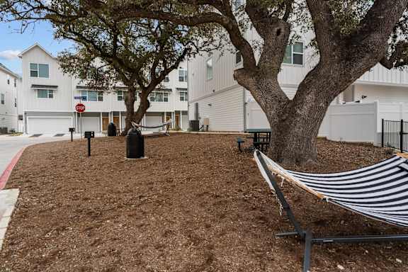 Courtyard With Mature Trees at Villae ATX Luxury Rental Townhomes, Manchaca, Texas
