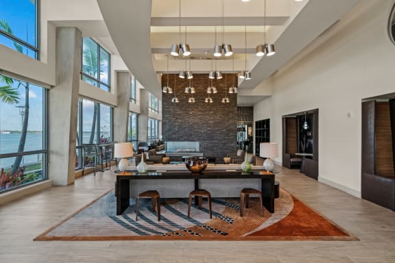 a living room with a large table and a large window