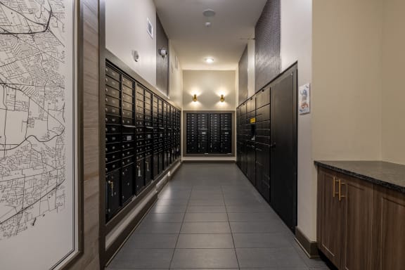 a long hallway with wine racks and a map on the wall