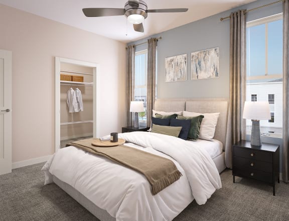 a bedroom with a bed and a ceiling fan