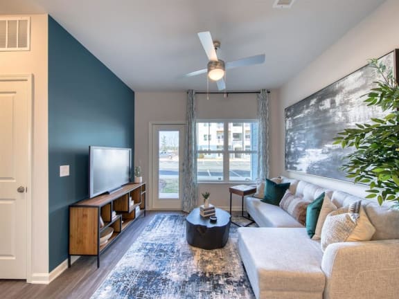 a living room with a couch and a tv