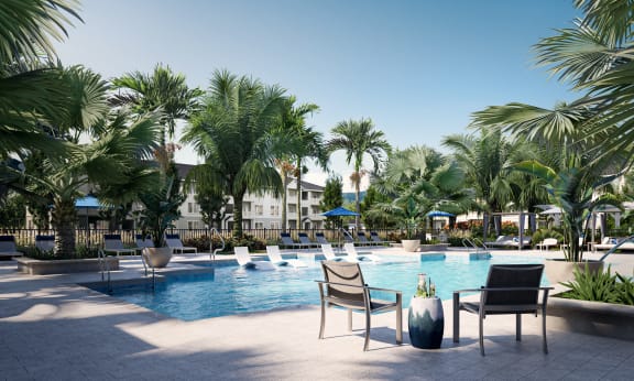 a large swimming pool with lounge chairs and palm trees