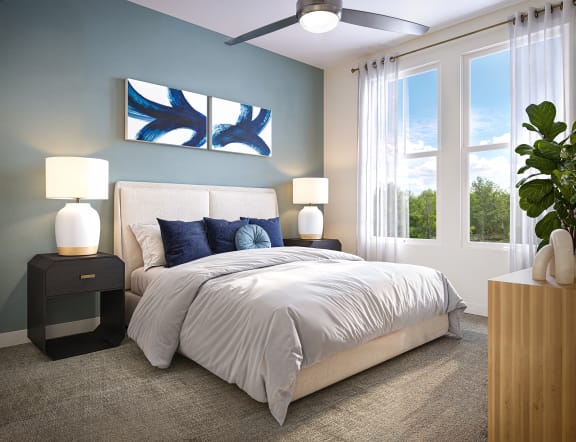 a bedroom with a bed and a ceiling fan