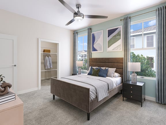a bedroom with a bed and a ceiling fan
