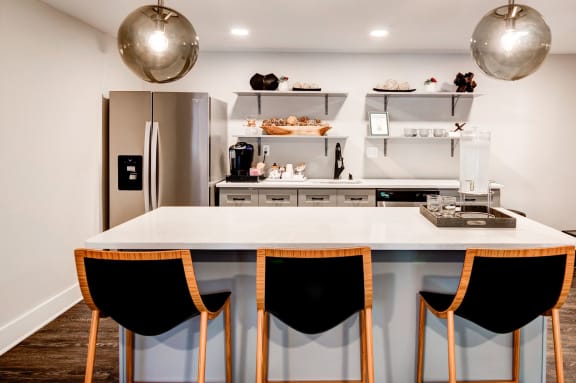 a kitchen with a large center island with a white countertop at Hamilton at Kings Place, Columbia