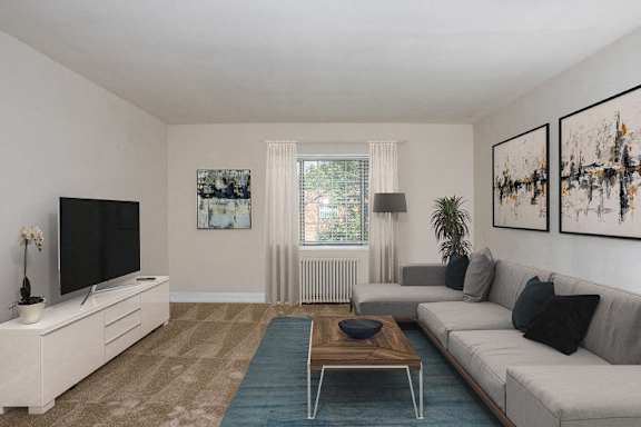 A living room with a couch and a coffee table at Hamilton Manor Apartments, Hyattsville, Maryland