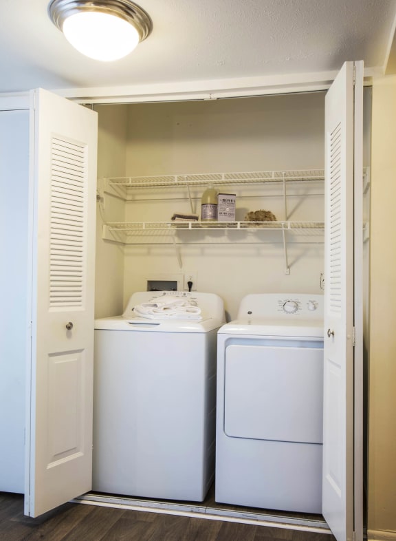 a small laundry room with a washer and dryer at Madison at Eden Brook, Columbia, MD