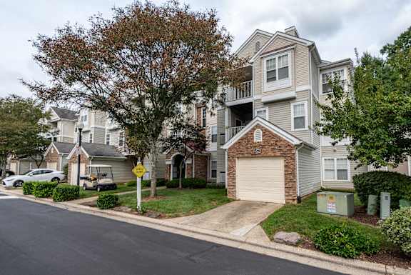 Townhome style building with attached garage at Park at Winterset Apartments, Owings Mills