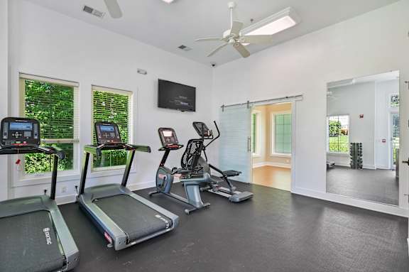 A gym with treadmills at Poplar Glen Apartments, Columbia, 21044.