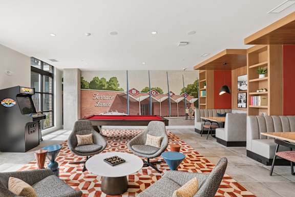 A living room with a red and white patterned carpet.
