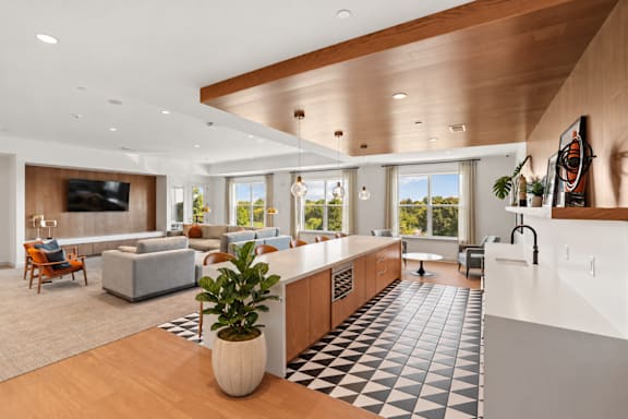 A modern kitchen with a black and white checkered floor.