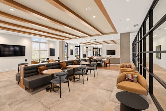 A modern living room with a brown and beige color scheme.