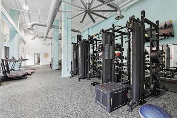 Gym with variety of equipments at Midtown at Camp Springs, Maryland, 20746