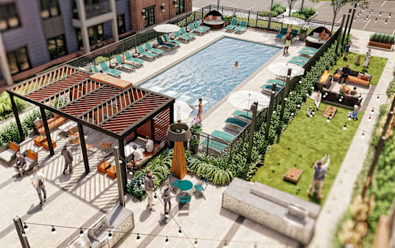 A pool area with people relaxing and a bar area.
